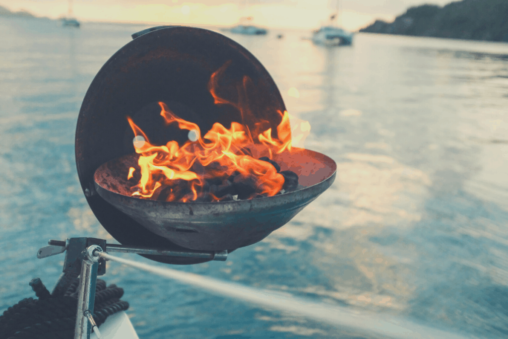 Boat grill charcoals on fire